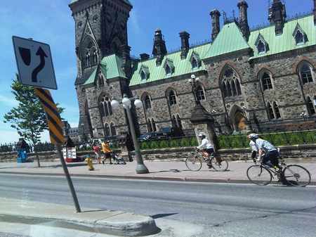 cycling past the Parliament buildings, Ottawa